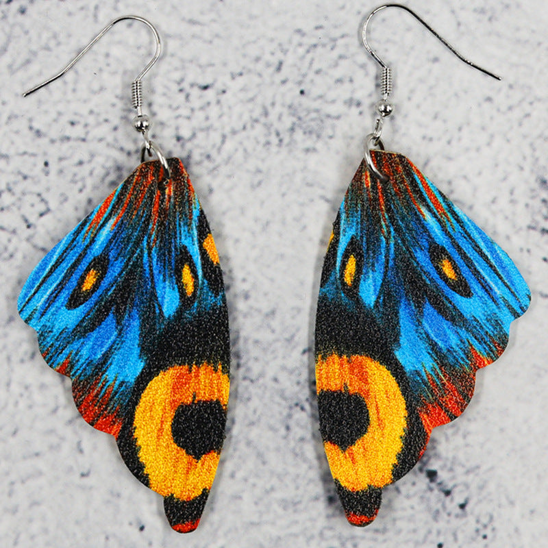 Pendientes de cuero de alas simétricas de mariposa al por mayor